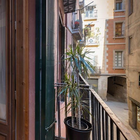 Look out over the colourful, narrow streets from your balcony