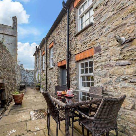 Start the day with a cup of coffee and a Welsh cake in the courtyard