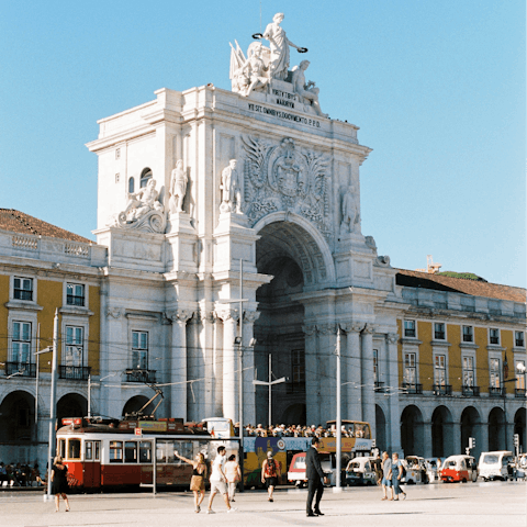 Stroll twenty minutes to Praça do Comércio and explore Lisbon