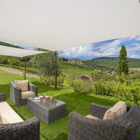 Drink in the panoramic views over cocktails in the garden