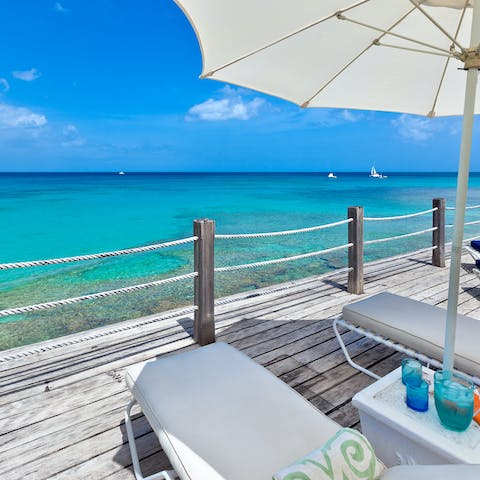 Soak up the sun overlooking the turquoise waters of the Caribbean Sea