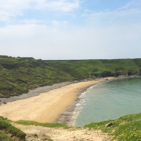 Stroll along the sand at Aberdaron Beach, just short drive away