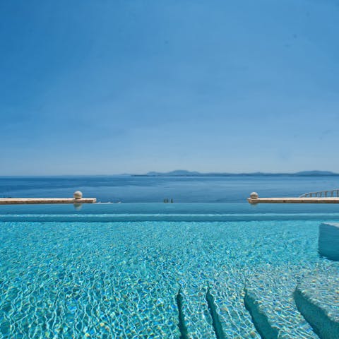 Take a dip in the private pool and admire the Aegean Sea