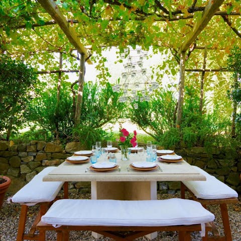 Enjoy a meal in the lush and breezy garden