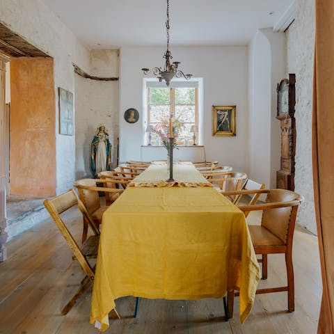 Sit down to meal together at the long dining table