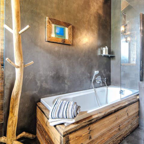 Relax in the rustic bathtub with a glass of wine after the kids have gone to bed