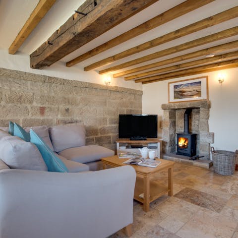 Spend chilly evenings relaxing by the fire with your favourite film playing on the TV