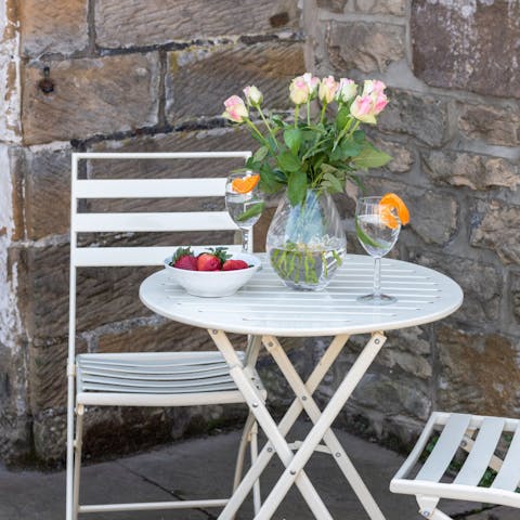 Enjoy a cup of tea or an evening cocktail out on the small patio