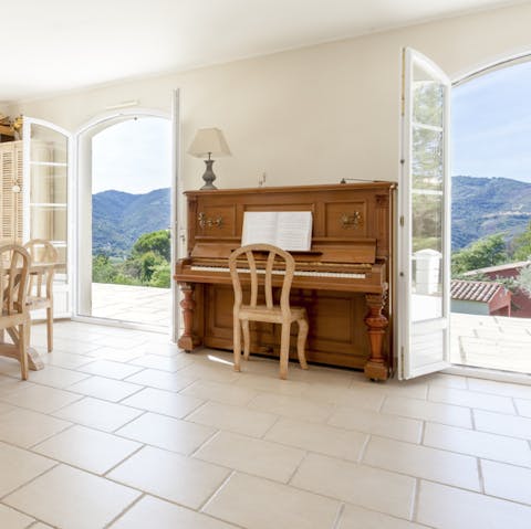 Gather the group around the piano for an after-dinner tune