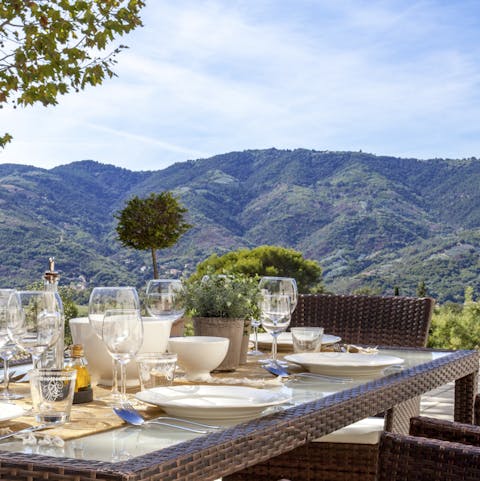 Admire the mountain panorama from the outdoor dining table