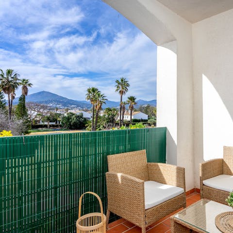 Sip your coffee on the private balcony and drink in the mountain views