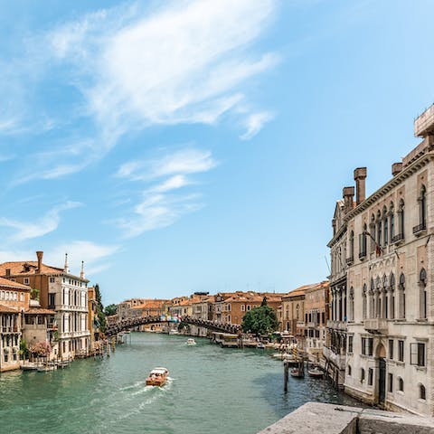 Admire breathtaking views of the Grand Canal from the private balcony
