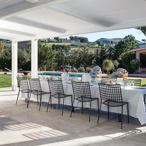 Gather at the outdoor dining table for alfresco feasts with loved ones 