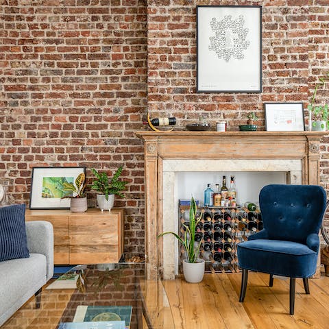 Spend evenings relaxing in brick-walled living space, a gin and tonic in hand