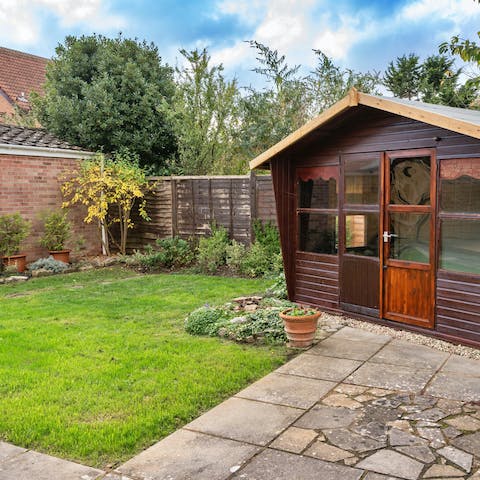 Watch little ones play house in the garden's summer room