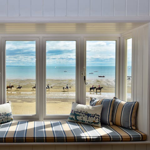 Gaze out over the breathtaking beach vista from the comfort of your living room