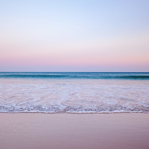 Enjoy a sunset stroll along Praia das Maçãs, within walking distance