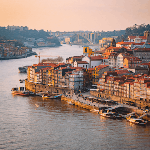 Enjoy a sunset stroll along Cais da Ribeira, ten minutes from your apartment