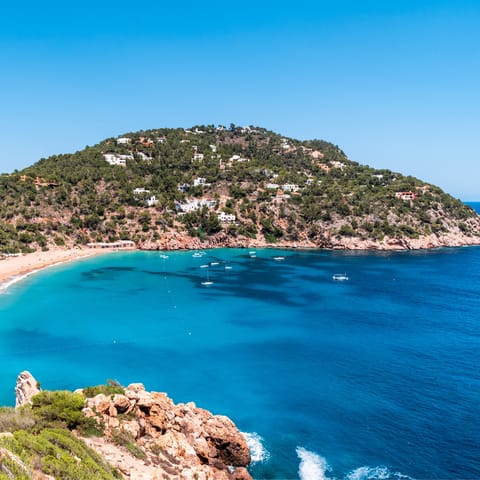 Slide on your sandals and take a morning stroll to Cala San Vicente 