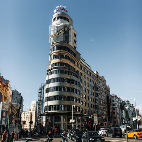 Admire the striking architecture along Gran Vía, reachable on foot from your home