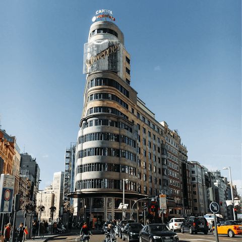 Admire the striking architecture along Gran Vía, reachable on foot from your home