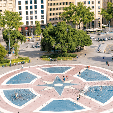 Drive down to Plaça de Catalunya, Barcelona's most central area