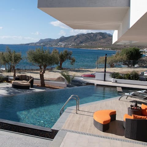 Take a dip in the sparkling swimming pool with views across the seascape 