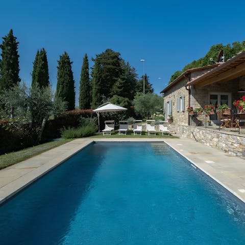 Relax on a poolside lounger before enjoying a rejuvenating dip in the water