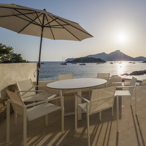 Dine alfresco and look out at the boats and calm waters of the Cala es Conills