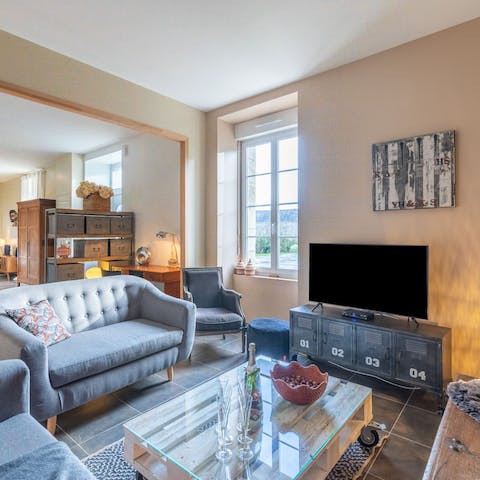 Relax in the snug living room after a day of discovering Caden