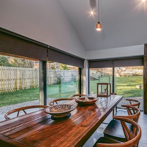 Set up for family breakfasts at the long table bathed in sunlight