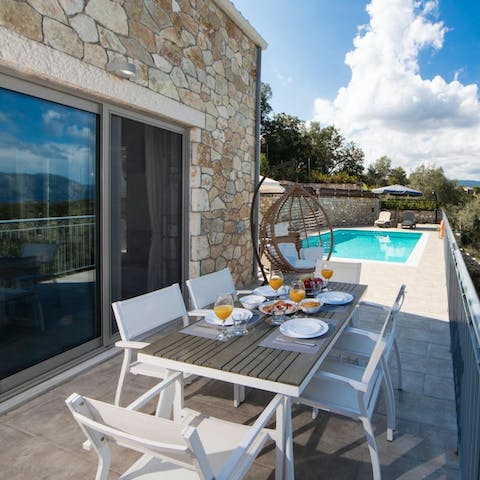 Serve up some Greek-inspired culinary delights at the alfresco dining area