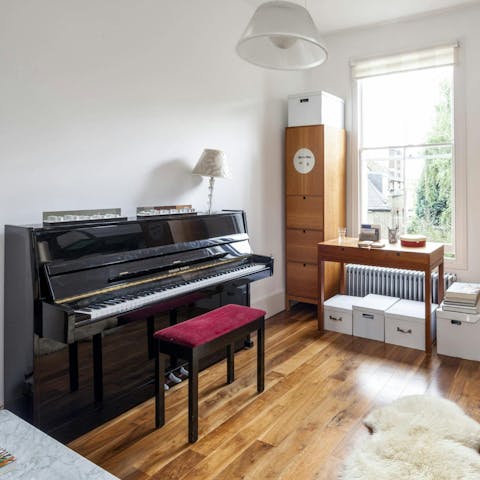 Play a tune or two on the piano in the living area