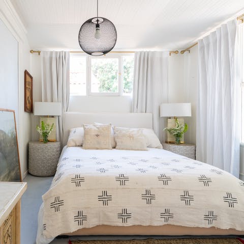 Wake up in the effortlessly chic bedroom