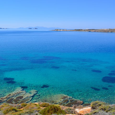 Swim in the crystal clear water of Kolimbithres beach – it's nine minutes away by car