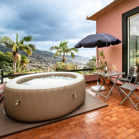 Have a cool drink while admiring the view or hop into the private Jacuzzi 