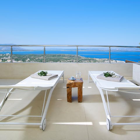 Catch some rays and gaze out to the Aegean Sea