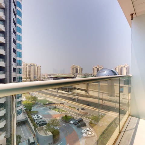 Enjoy views of the city from the private balcony