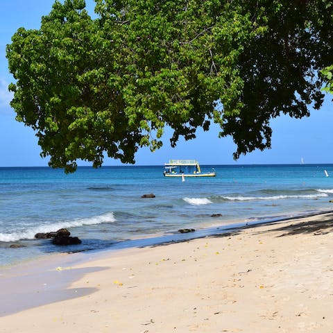 Explore the beaches of Barbados, including Paynes Bay Beach, under a fifteen-minute drive from your home