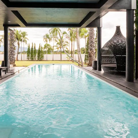 Enjoy moments of zen by the luxurious, covered outdoor pool 