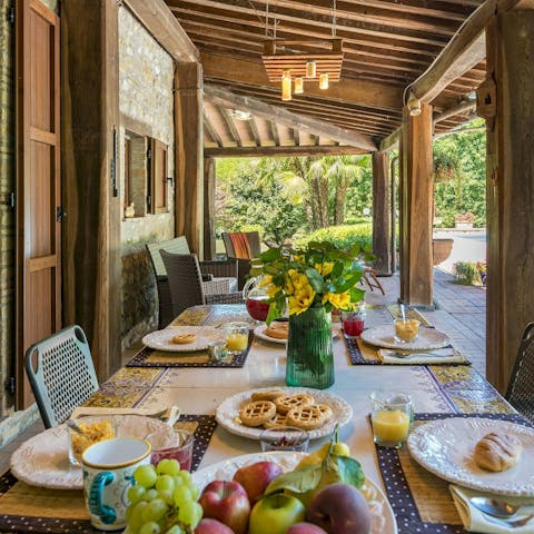 Enjoy pastries for breakfast on the covered terrace