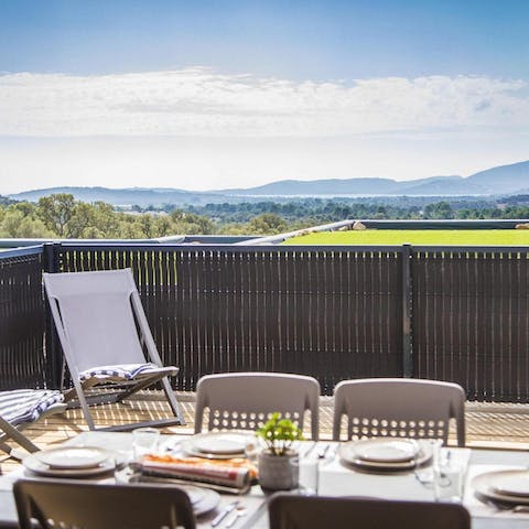 Enjoy alfresco feasts with your family and friends, with the sea glistening in the distance 