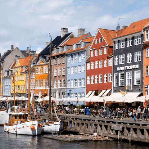 Grab a sunny spot here in Nyhavn, just a short stroll away