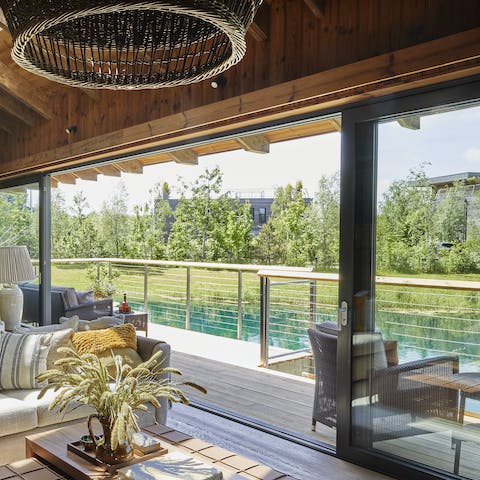Enjoy stunning views of the lake through the floor-to-ceiling doors