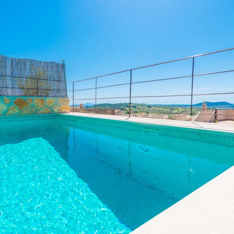 Plunge into your stunning pool and take in views across the rooftops