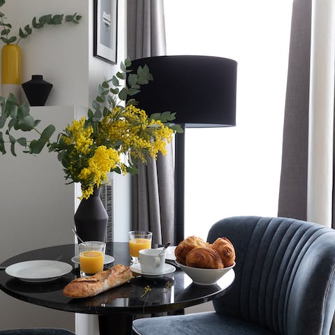 Sit down to a breakfast of fresh coffee and croissants at the chic table before setting for a day of sightseeing