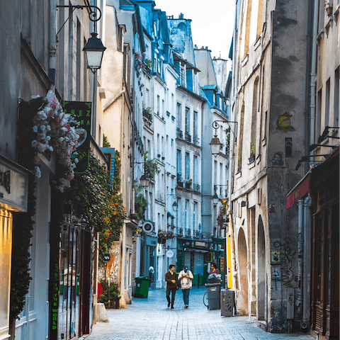 Explore the vibrant Marais district with its vintage shops and cosy cafés, a fifteen-minute stroll from your door