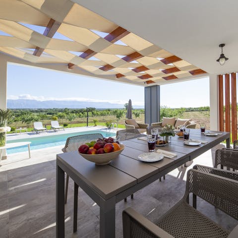 Eat some fresh fruit in the shade of your outdoor dining table