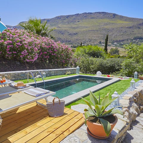 Admire the mountain views whilst lounging by the pool 