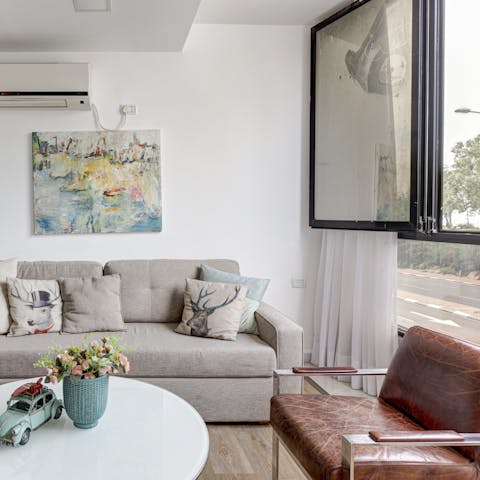 Relax in the bright living space after a busy day exploring the city